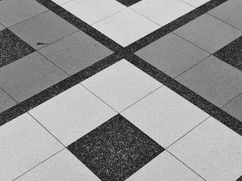 Close-up of clean vitrified tile grout line and polished surface