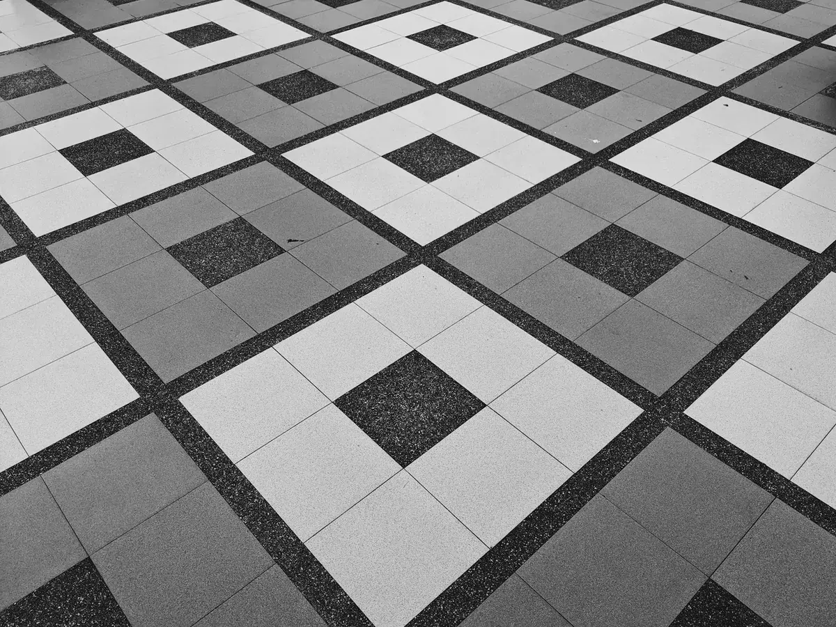 Clean polished ceramic tile floor with neat grout seams
